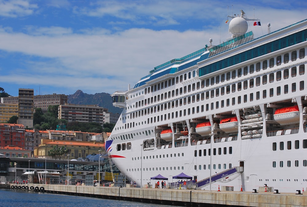 a large cruise ship docked in a harbor