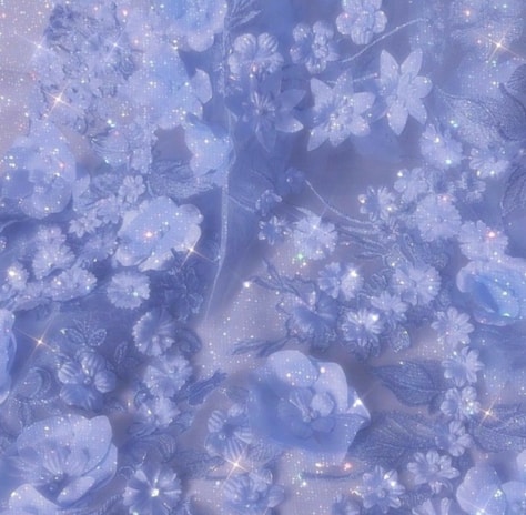 Soft golden glitter shimmering over a background of pink and lilac flowers