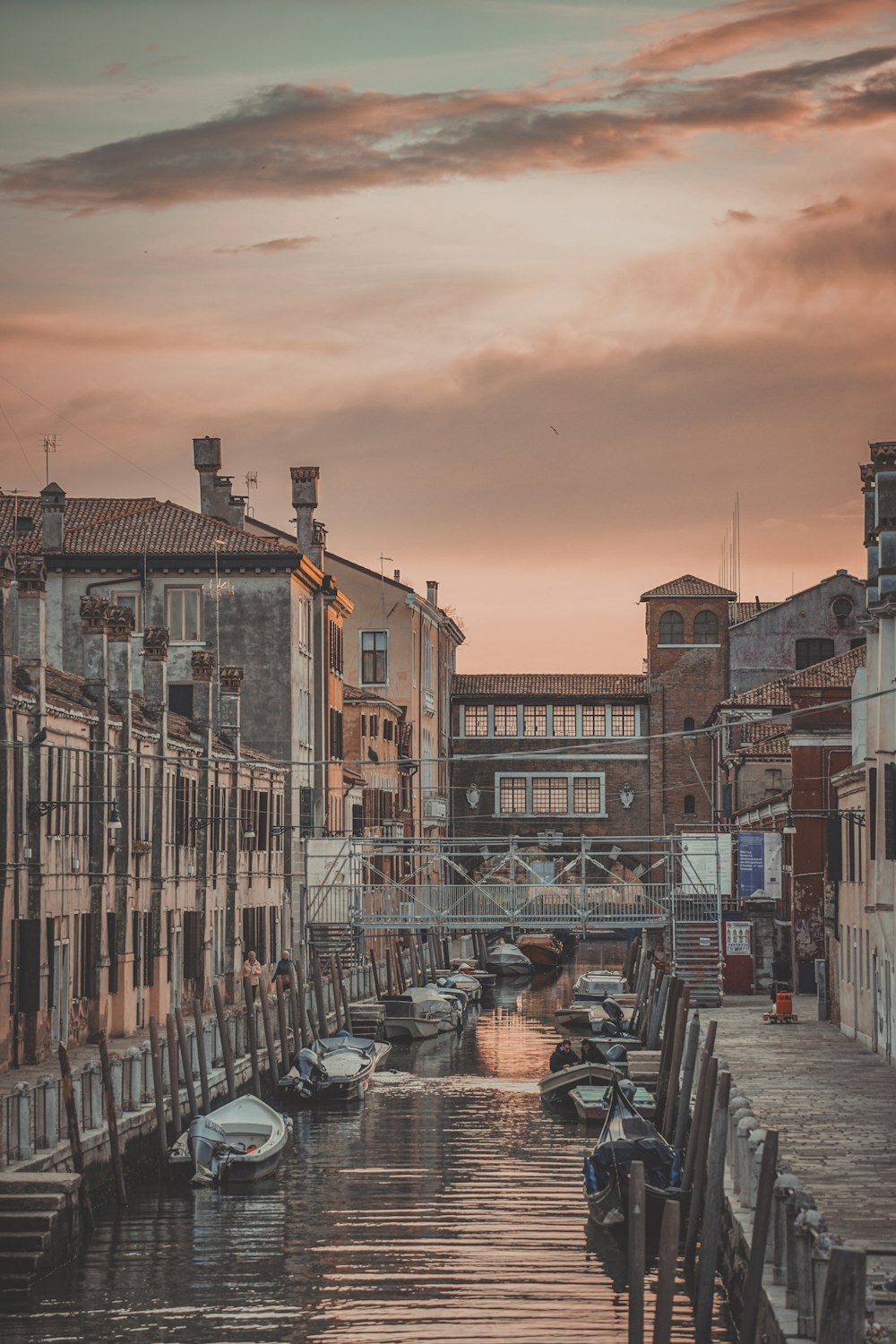 a canal that has some boats in it