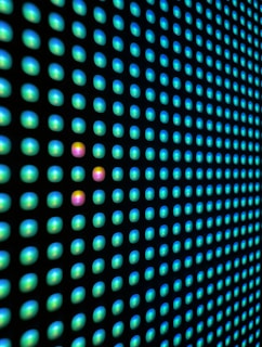 a close up of a wall with a lot of dots on it