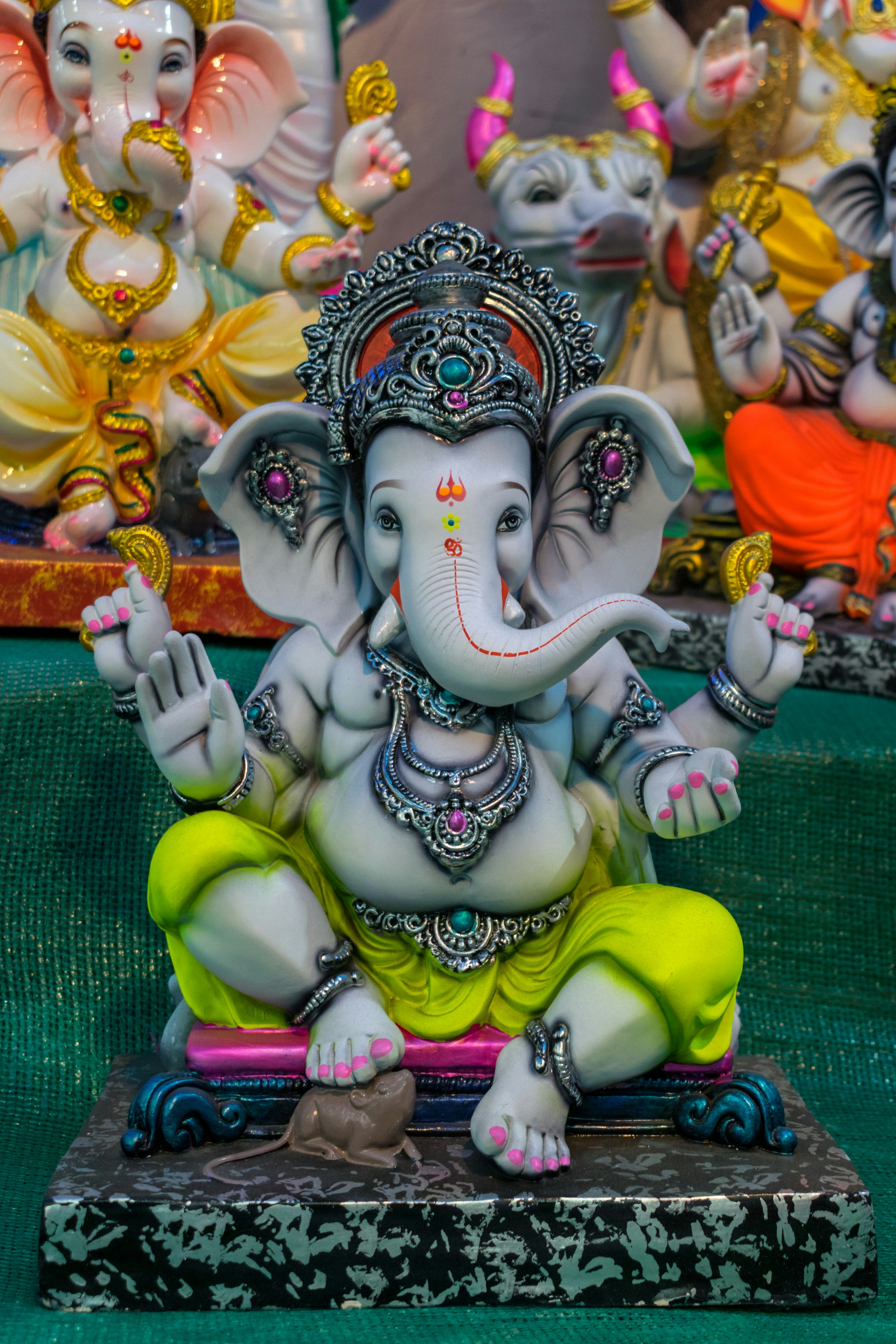 a statue of an elephant sitting on top of a table