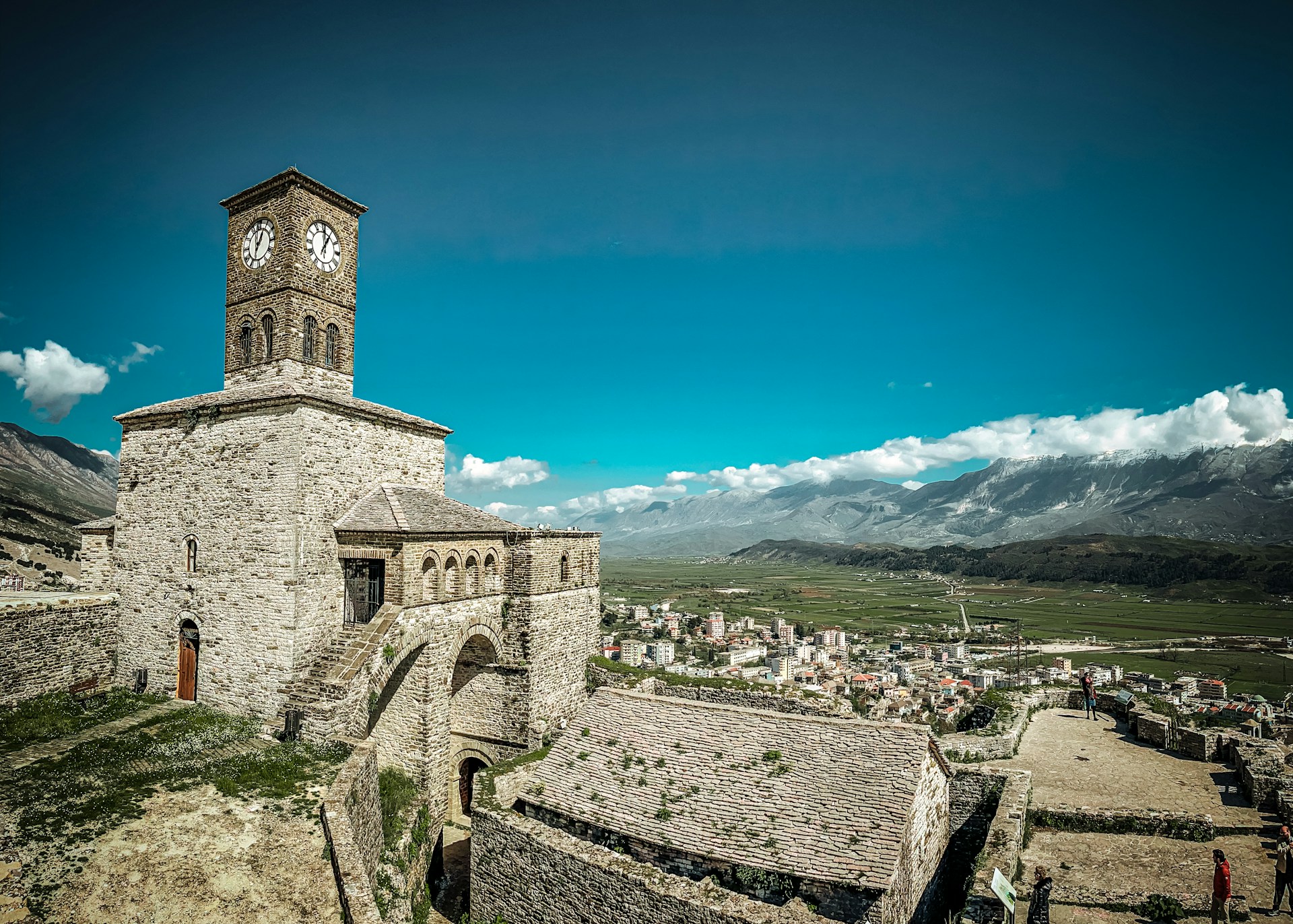 a clock tower on top of a stone building