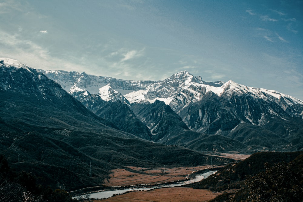 a view of a mountain range with a river running through it