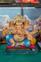 a statue of a ganesh sitting on a table