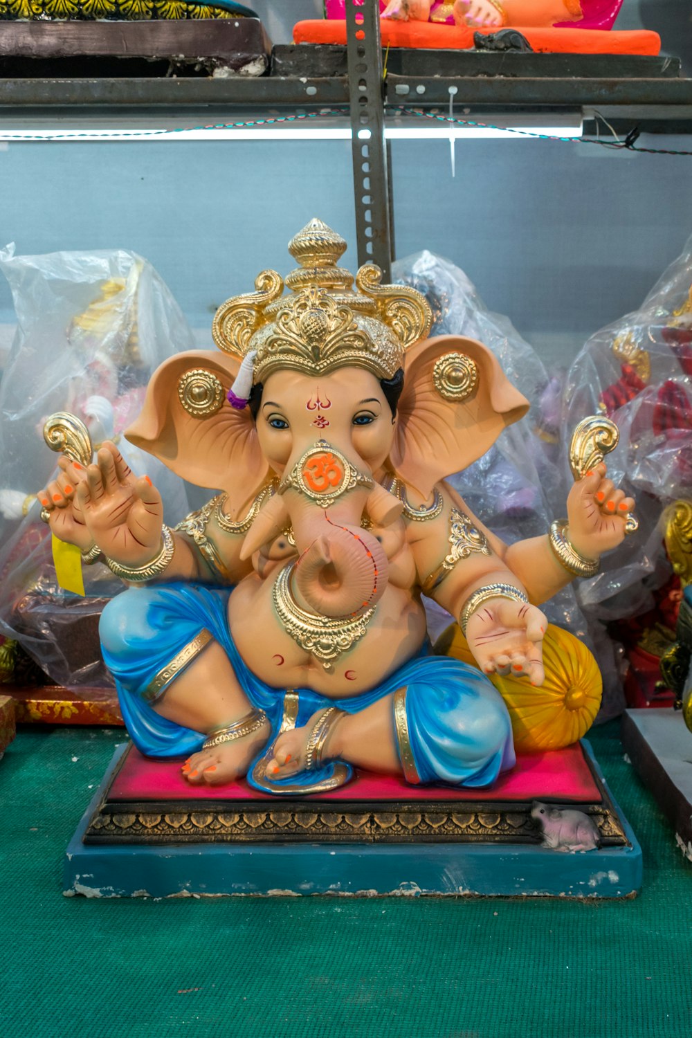 a statue of a ganesh sitting on a table