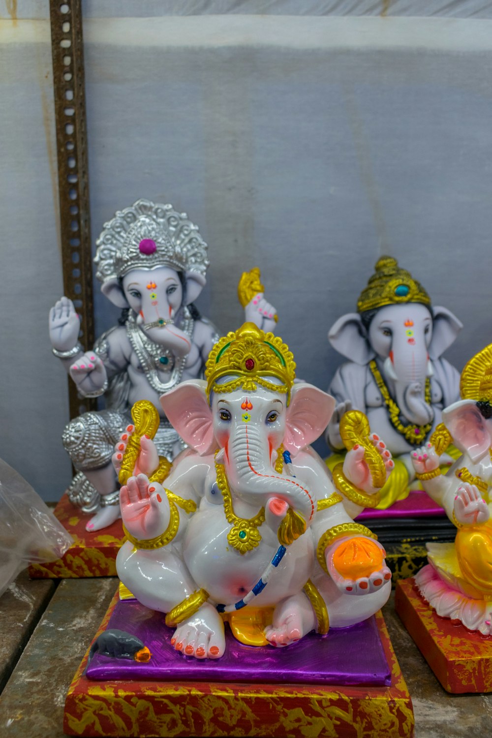 a group of small statues of elephants on a table
