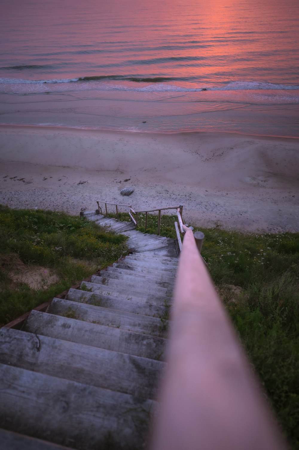 a set of stairs leading down to the beach