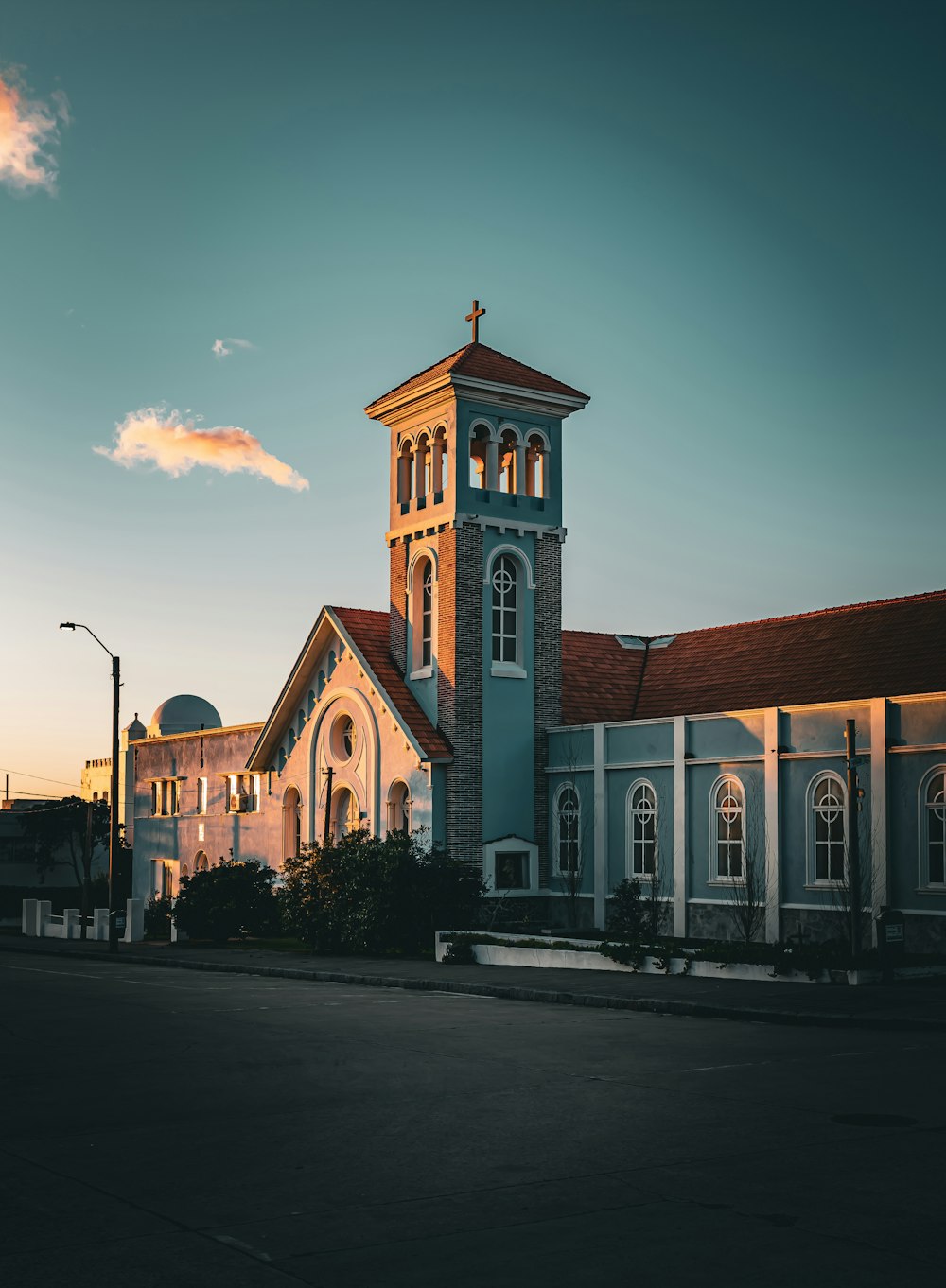 a church with a steeple and a clock tower