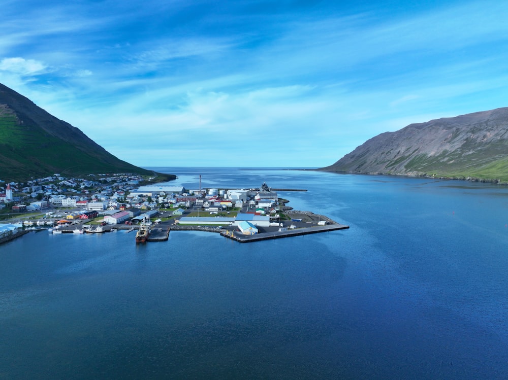 a large body of water with a small town in the middle of it