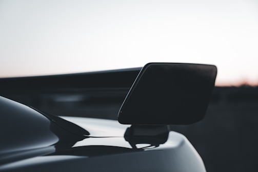 A close-up of a stylish spoiler fitted on a vehicle.