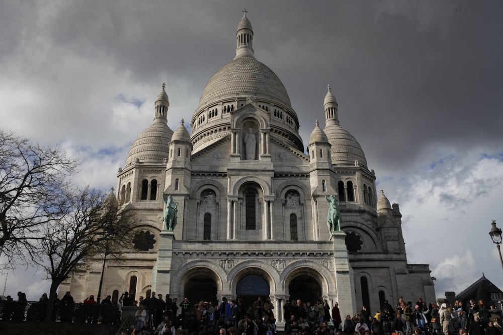 a group of people standing in front of a building