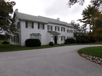 Spacious colonial-style home with a large backyard ready for renovation.