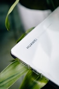 a laptop computer sitting on top of a table