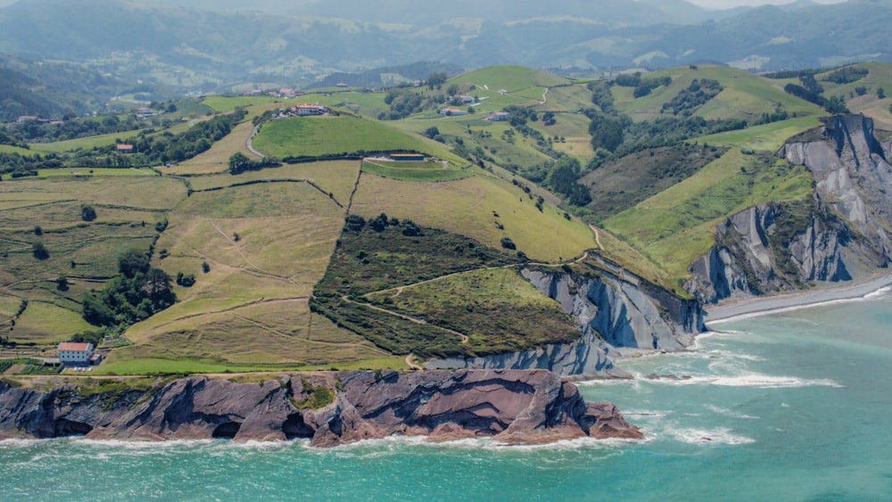 an aerial view of the ocean and land