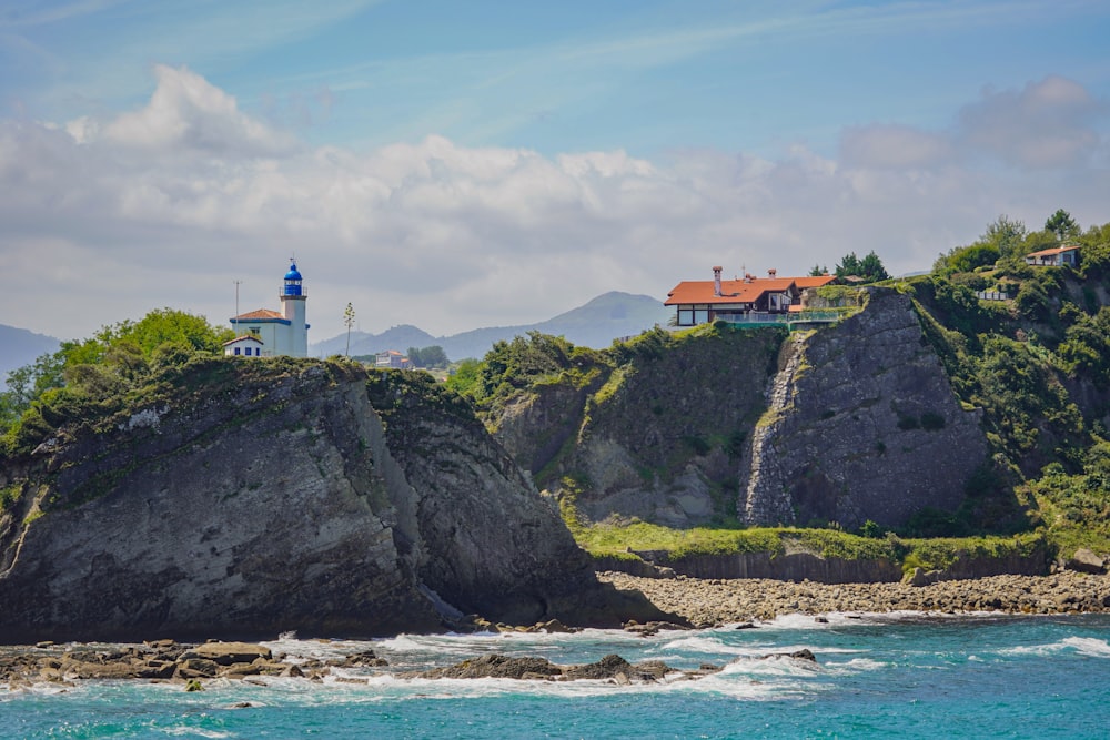 a house on a cliff overlooking the ocean