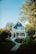 a blue and white house with a porch