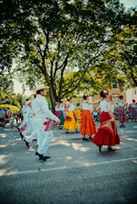 a group of people that are dancing in the street