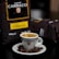 A ceramic cup filled with espresso is placed on a saucer surrounded by coffee beans. In the background, there is packaging with the name 'Caffè Carracci' and the label 'Firenze' visible.