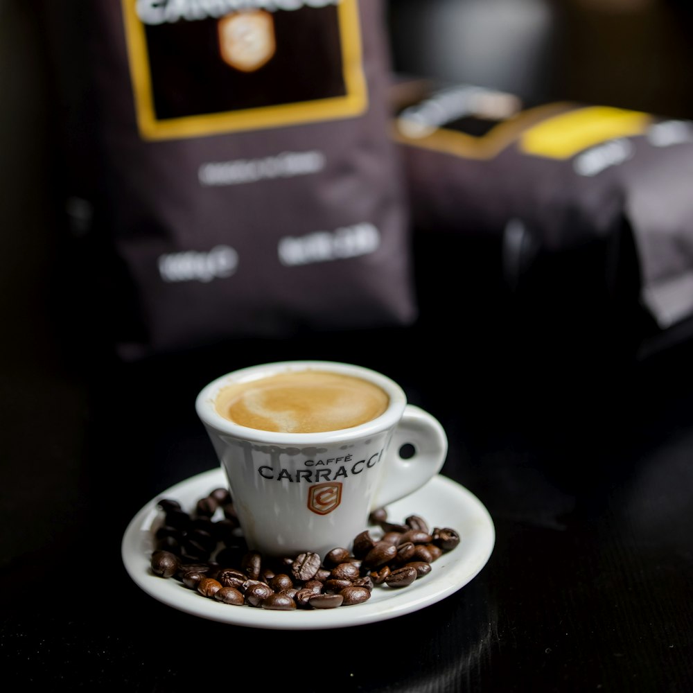 a cup of coffee sitting on top of a white saucer