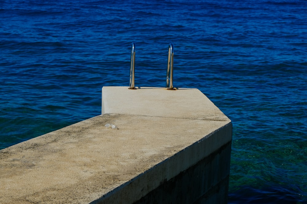 a couple of poles sticking out of the water