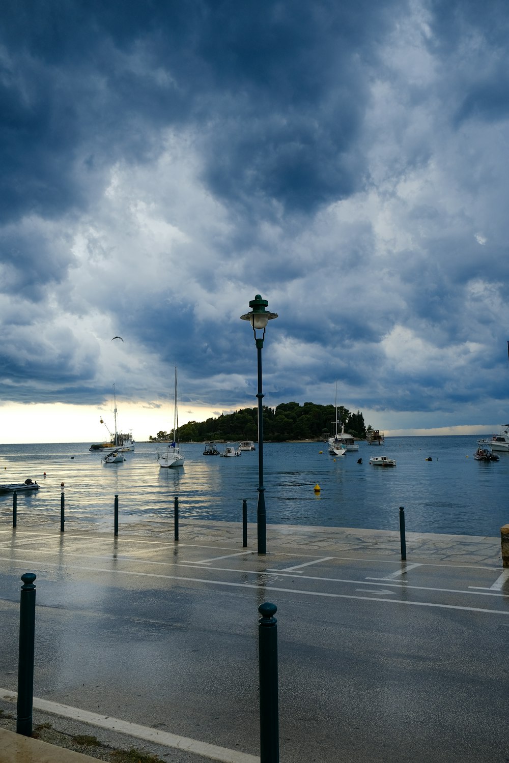 a parking lot with a bunch of boats in the water