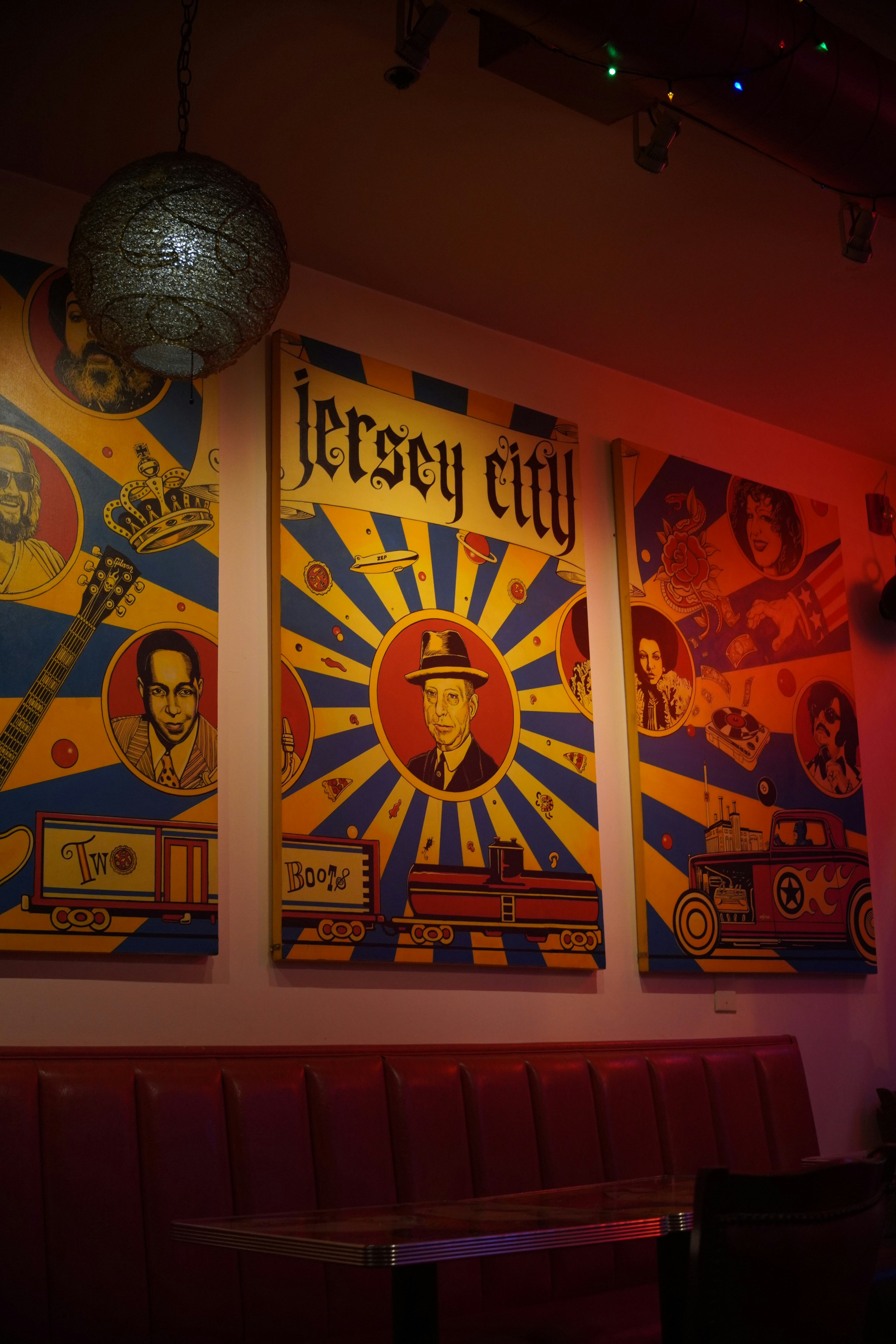 a couple of posters on the wall of a restaurant