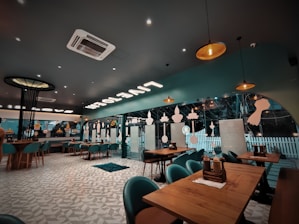 Cozy restaurant interior with teal accents and elegant Ottoman-inspired décor.