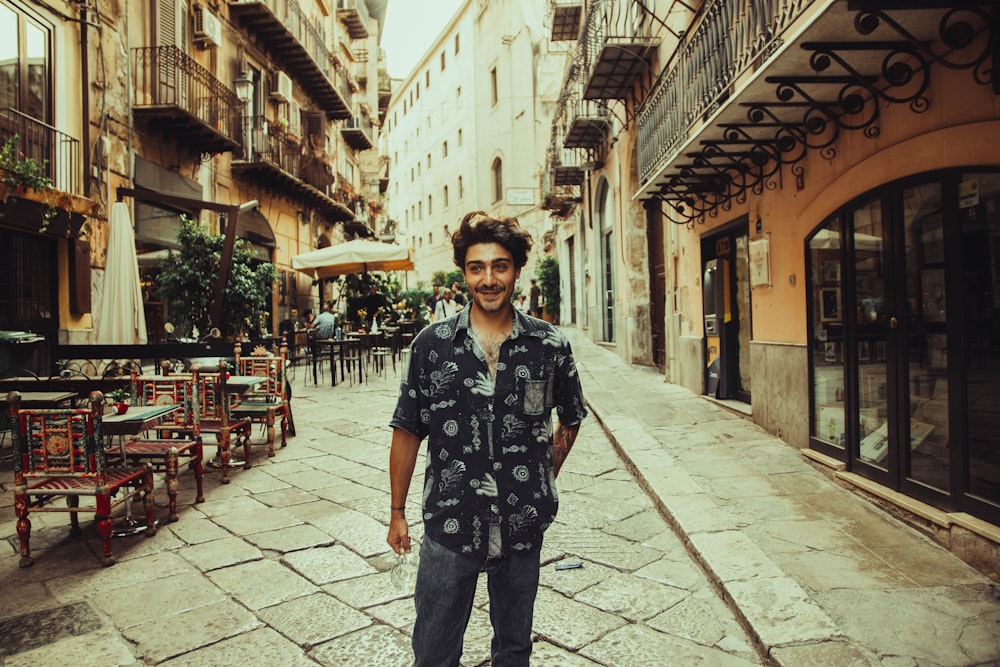 a man standing in the middle of a street