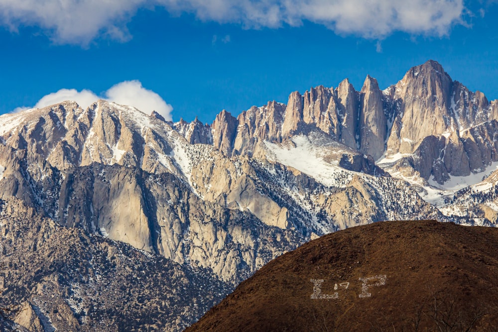 a view of the mountains from the top of a hill