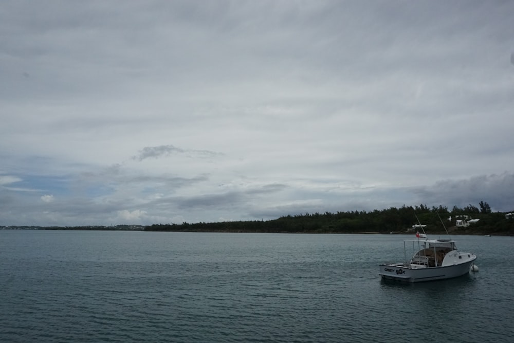 a boat floating on top of a large body of water