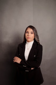 a woman standing with her arms crossed