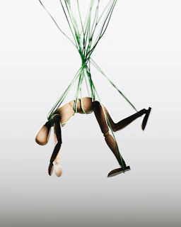 a woman in a tight bodysuit is suspended in the air