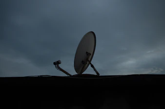 a satellite dish sitting on top of a roof
