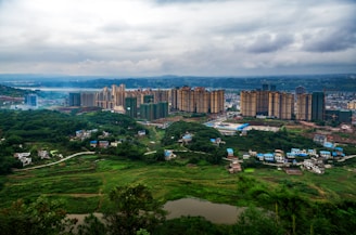 A panoramic view of a newly developed urban residential complex with green spaces.