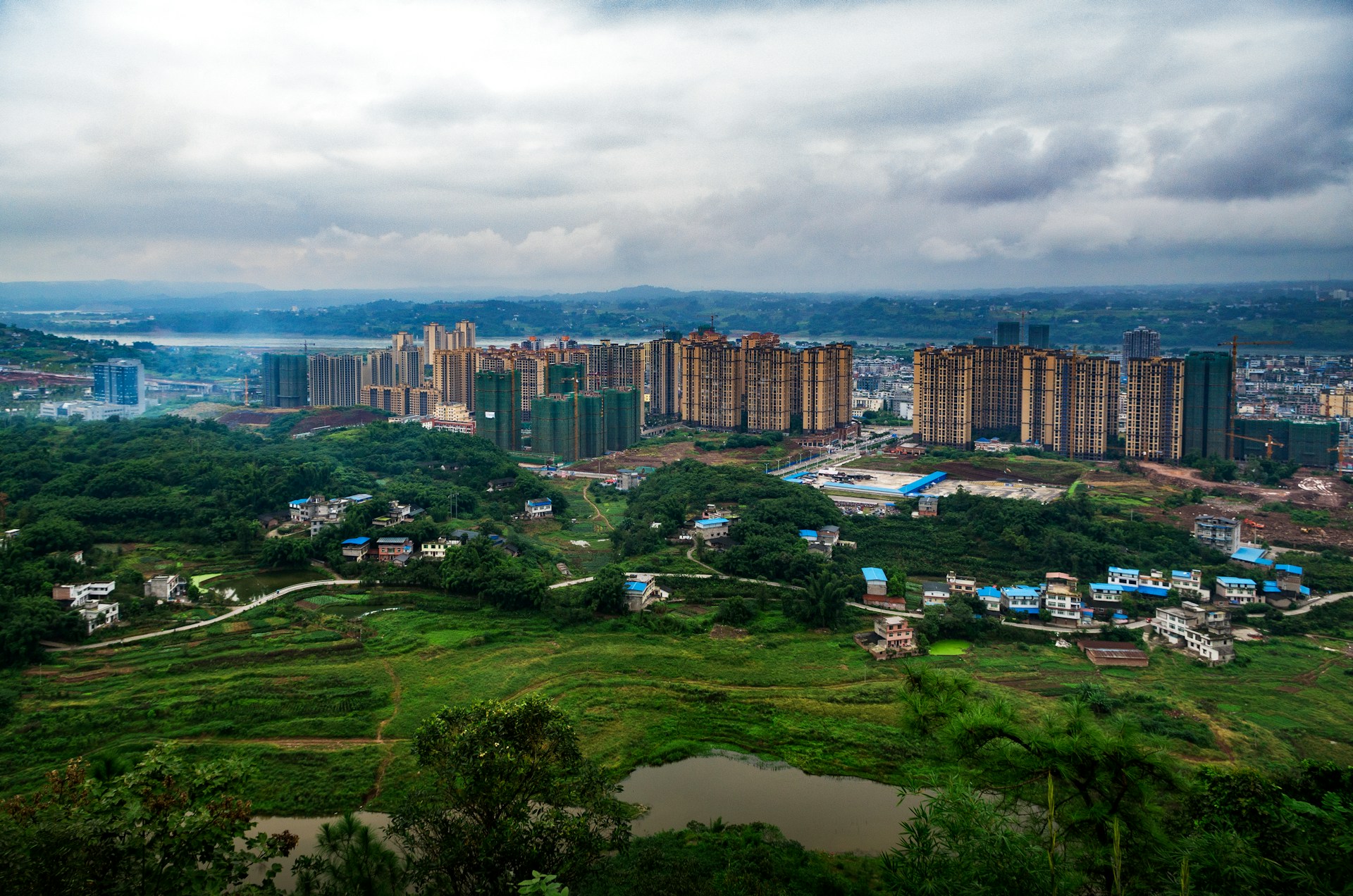 woman wearing yellow long-sleeved dress under white clouds and blue sky during daytime