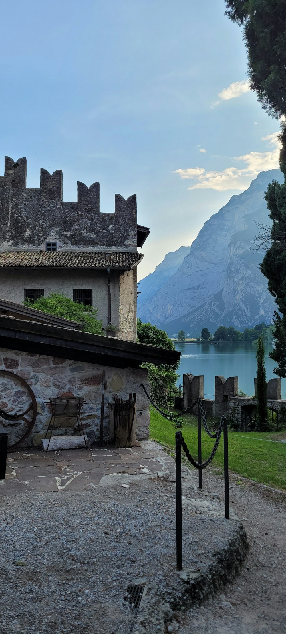 a stone building with a mountain in the background