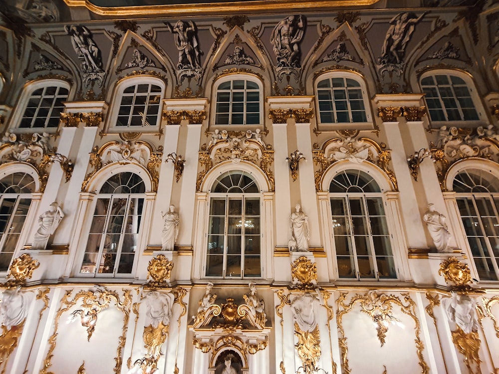 a large building with many windows and gold decorations