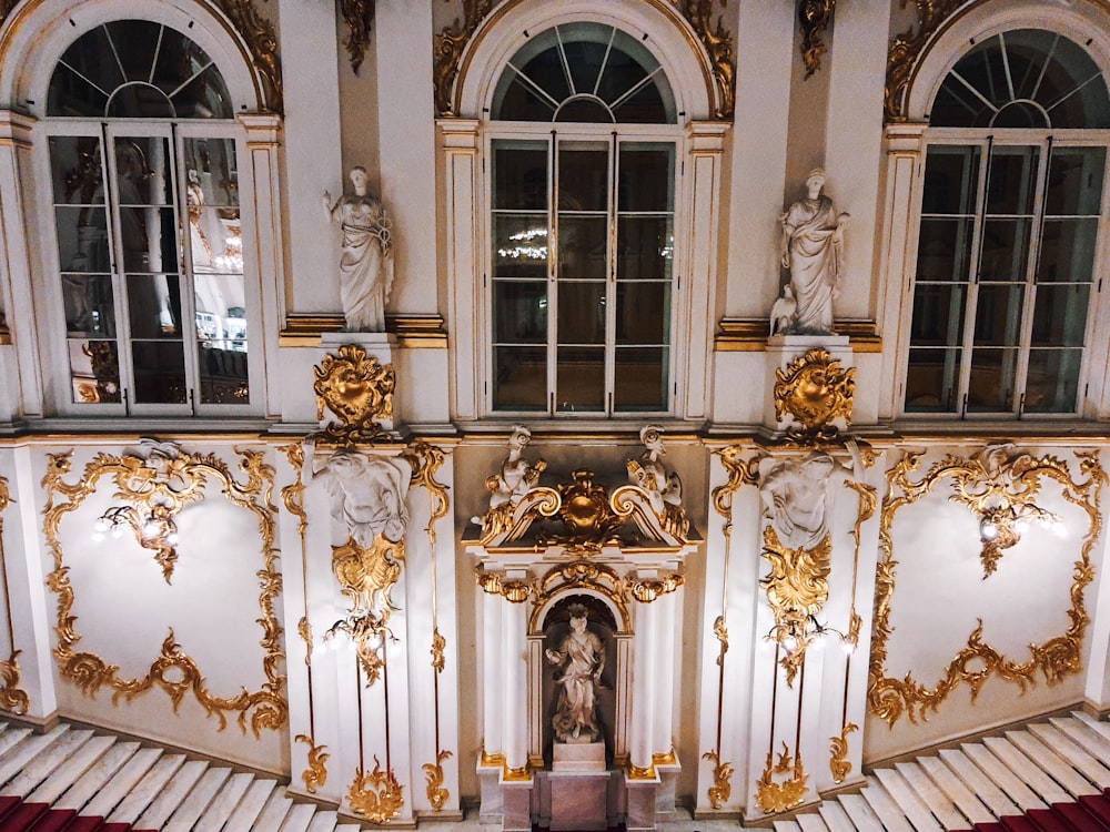 an ornately decorated room with a statue in the center