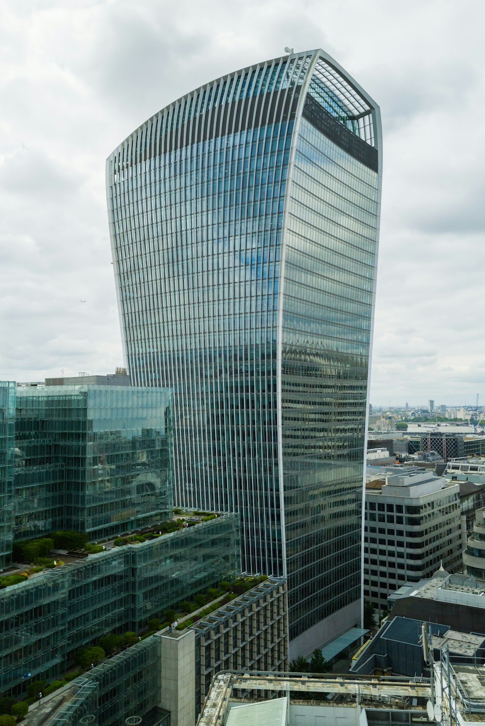 a very tall glass building in a city