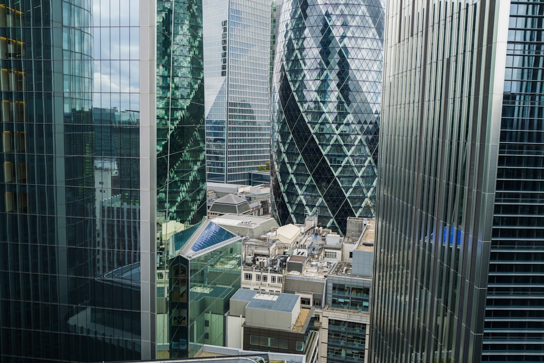 a view of some very tall buildings in the city, Office buildings