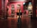 An art gallery interior with several large, classical paintings displayed on deep red walls. The floor is made of polished wood with decorative patterns. Ornate, classical-style furniture and vases are placed around the room. The lighting is soft, highlighting the artwork.