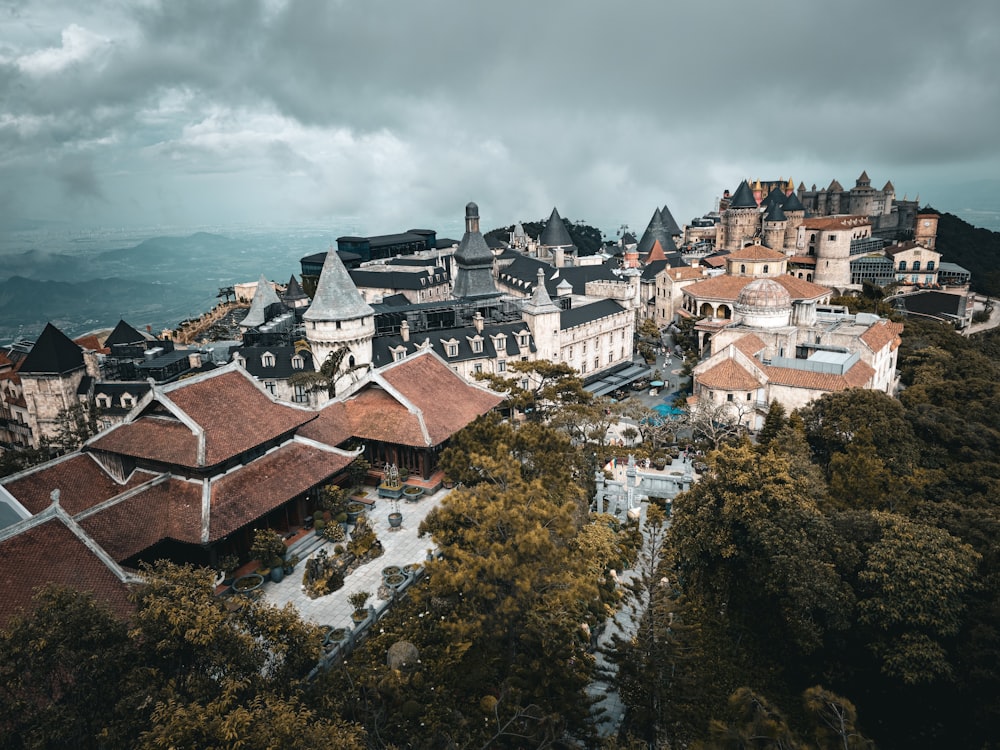 an aerial view of a city with a mountain in the background