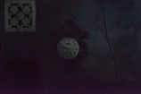 A dimly lit photo of a vintage clock showing a forgotten time.