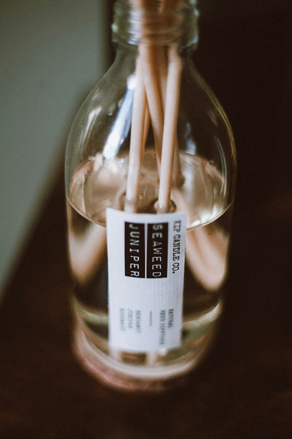 a glass jar filled with a couple of pencils