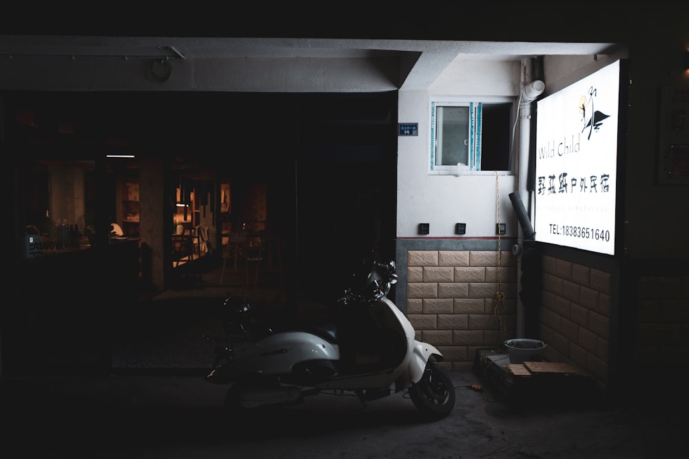 a scooter is parked in a dark room