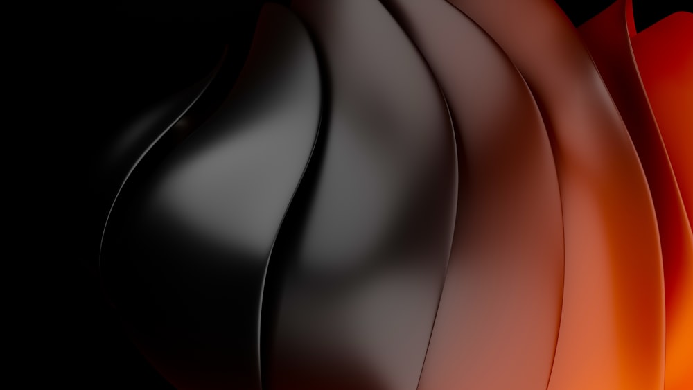 a close up of a black and orange vase