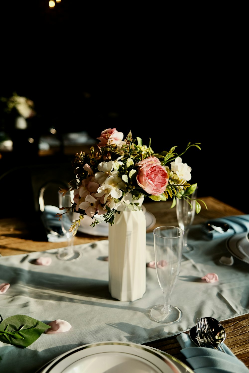 a table with a vase of flowers on it