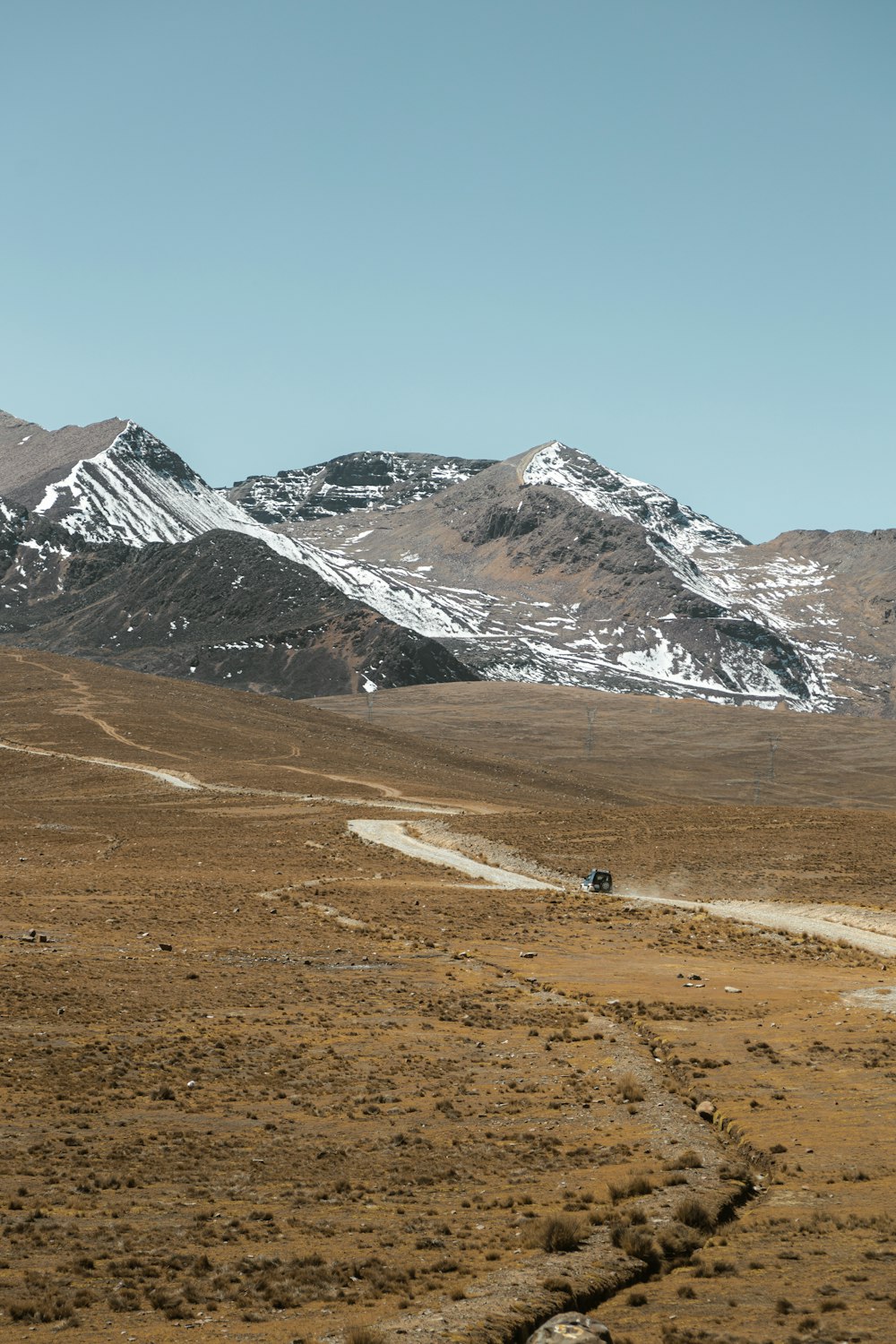 a dirt road in the middle of a mountain range