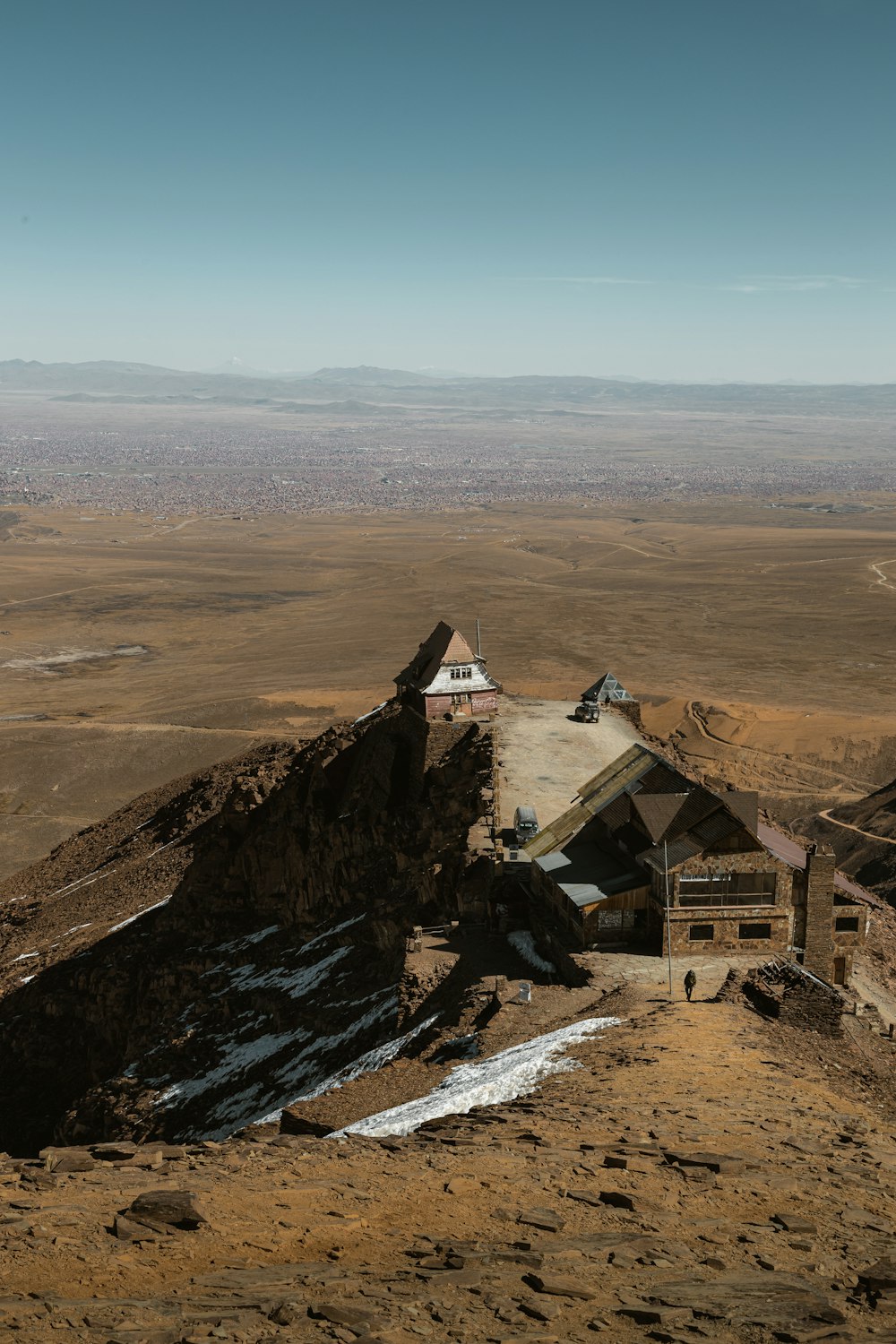 a mountain with a house on top of it