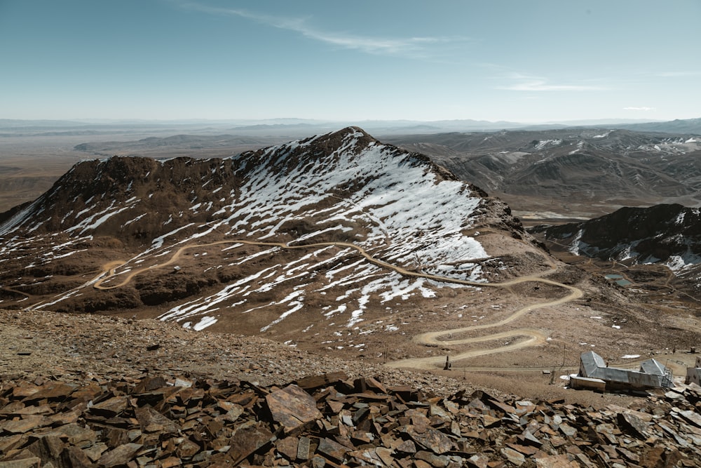 a view of a mountain with a trail going through it